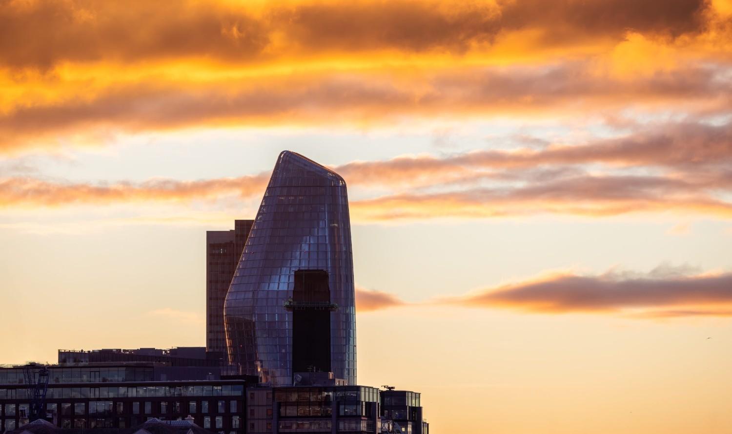 Modern Architecture Building during dramatic sunset. City of London, United Kingdom.